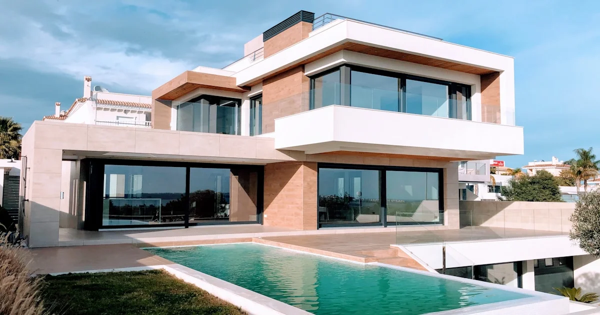 Modern white house exterior with a lawn